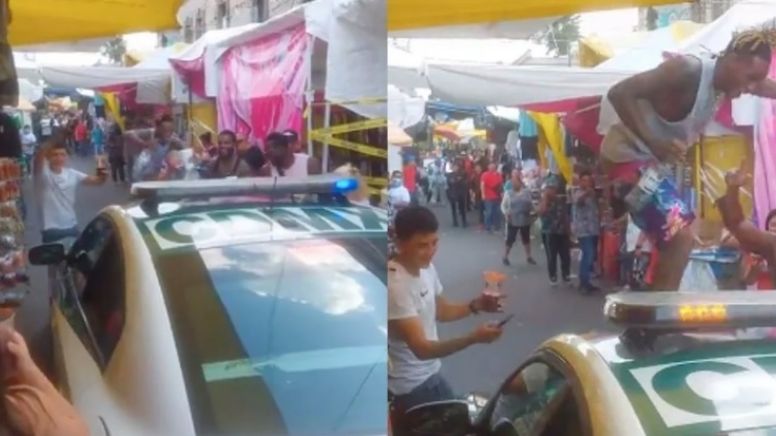 VIDEO Seguridad en Ciudad de México: Paran patrulla en un tianguis de Tepito y hombres bailan sobre ella